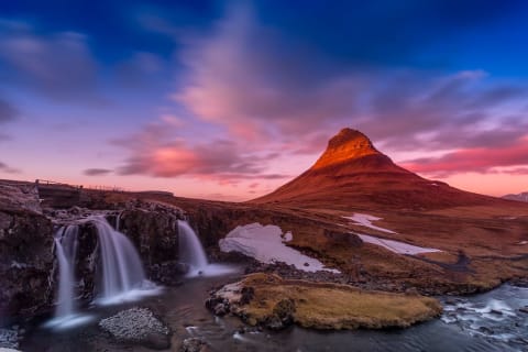 Mount Kirkjufell and Kirkjufellsfoss waterfall in Iceland