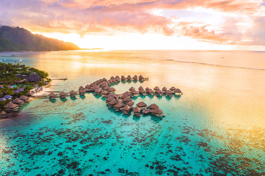 Overwater bungalows along coral reef in Moorea, French Polynesia