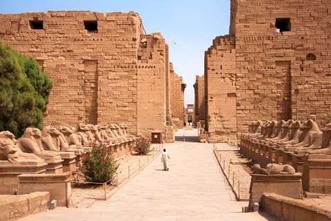 Entrance to Karnak temple in Luxor, Egypt with alley of ram headed sphinxes