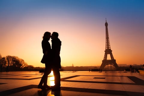 Silhouette of romantic honeymoon couple at the Eiffel tower in Paris at Sunset