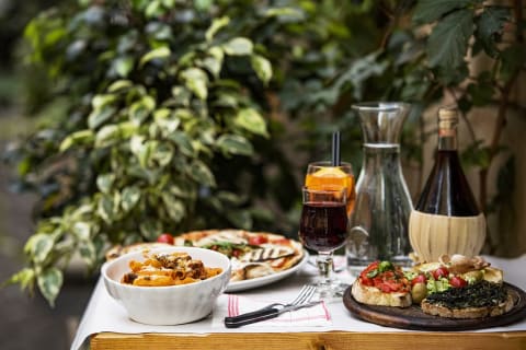 Italian food and wine set on an outdoor table